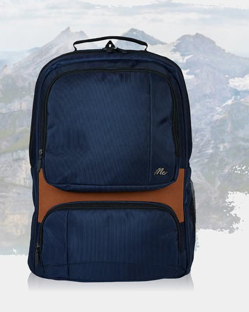 Navy blue backpack with brown accents on a mountainous background
